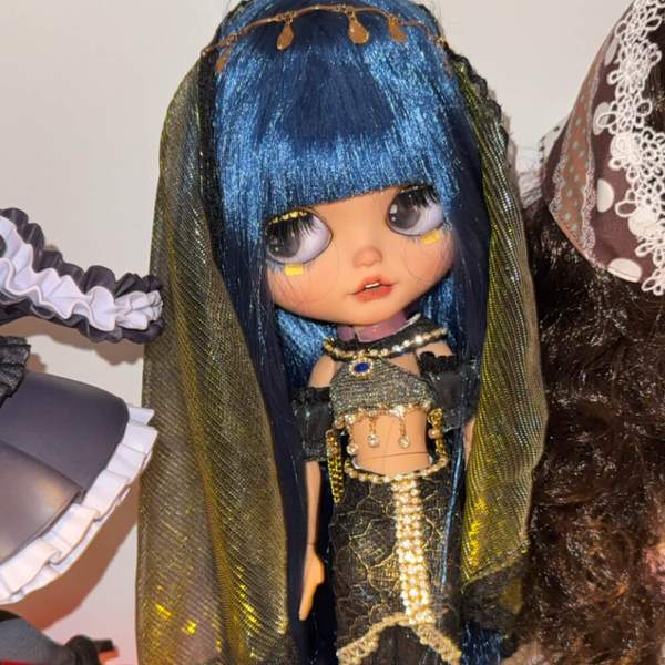 This Is Blythe customer photo from the United Kingdom: custom Cleopatra Blythe doll with blue hair and gold outfit
